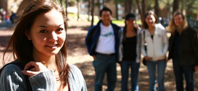 Student with parents in background